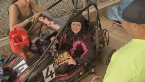 Mila Ricci in her racing car.