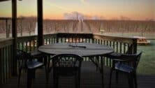 table on porch overlooking winery