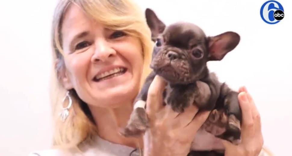 woman holding a dog