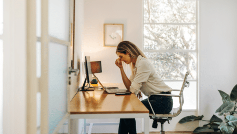 stressed woman sitting at desk