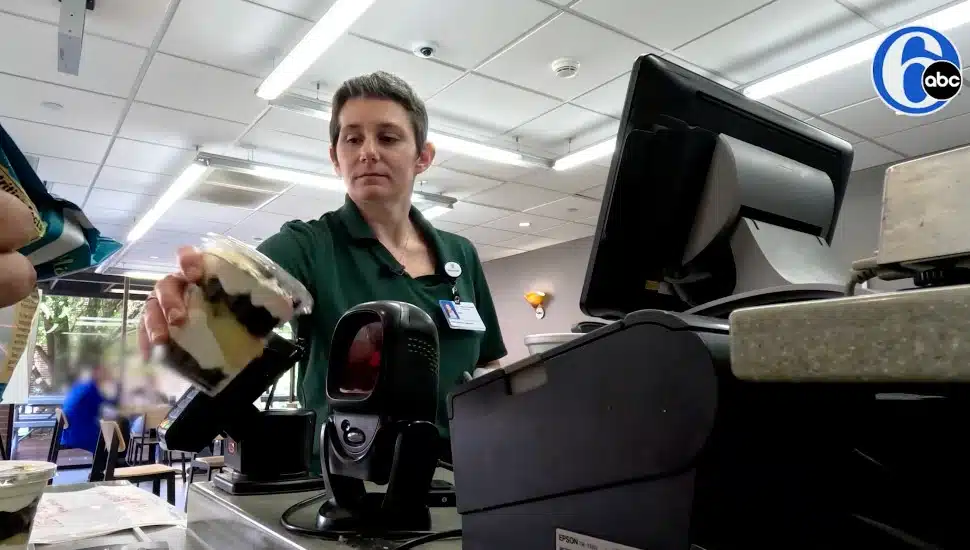 Amy Casarella behind a cash register at Paoli