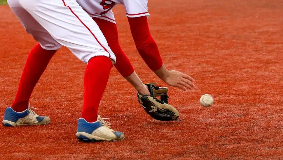 player catching ground ball on infield