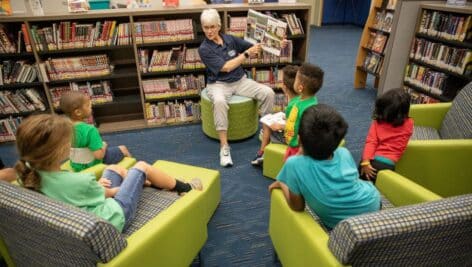 State Senator Carolyn Comitta reads to a group of children at the Chester County Library and District Center in Exton during the Library Card Sign-Up Fest.