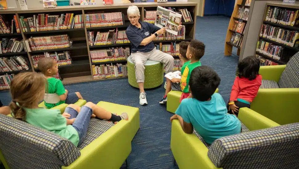 State Senator Carolyn Comitta reads to a group of children at the Chester County Library and District Center in Exton during the Library Card Sign-Up Fest.