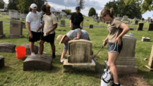 Hill Afternoon Community Service students learned how to effectively clean tombstones from Kelly Fenstermacher, pictured at work on the stone, who also has orchestrated the Walk to Remember historic Edgewood tour.