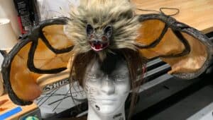 An animatronic creation of Skyler James, a wig with a realistic looking bat that moves.