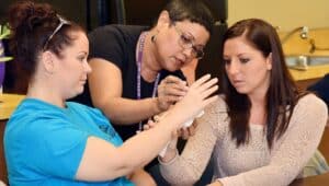 Harcum College Occupational Therapy students immersed in hands-on classroom activity.