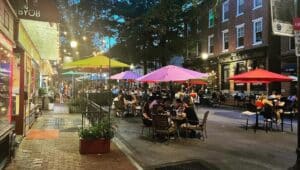 Taco Mar outdoor tables with tents in street at night