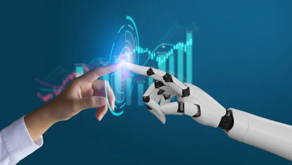 artificial intelligence concept with human and robot touching hands