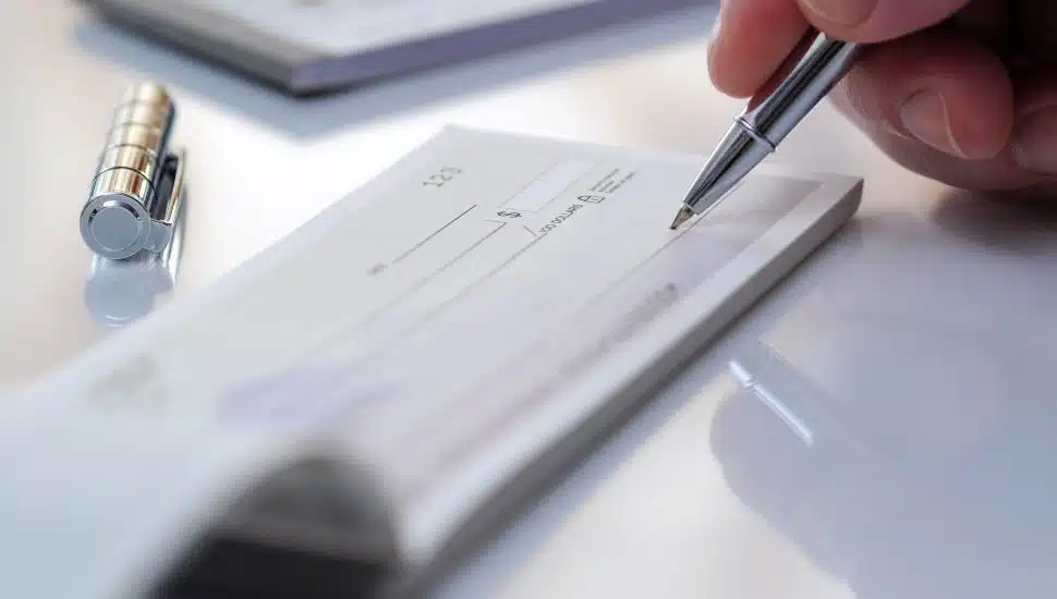 person writing a check