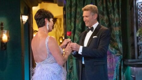 Golden Bachelor Gerry Turner hands a rose to Susan Noles of Aston on the first episode of Golden Bachelor.