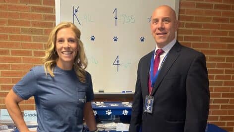 Lauren Piotrowski with Family Service is with Dr. Nick Argonish, principal at East Ward Elementary School in Downington.