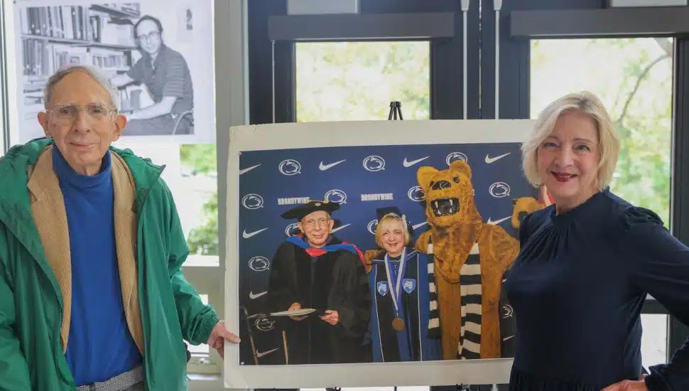 Stephen Cimbala, left, distinguished professor of political science, recently celebrated a career milestone when he completed his 50th year of service at Penn State Brandywine. Chancellor Marilyn J. Wells, right, and members of the Brandywine community gathered to celebrate this milestone.