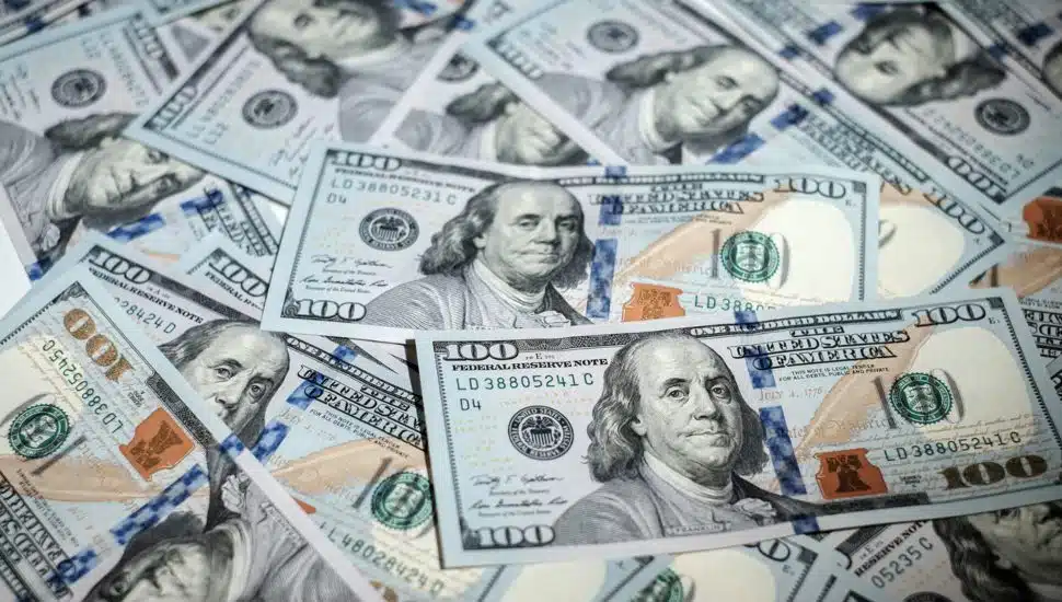 piles of 100 dollar bills