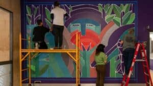 people painting mural