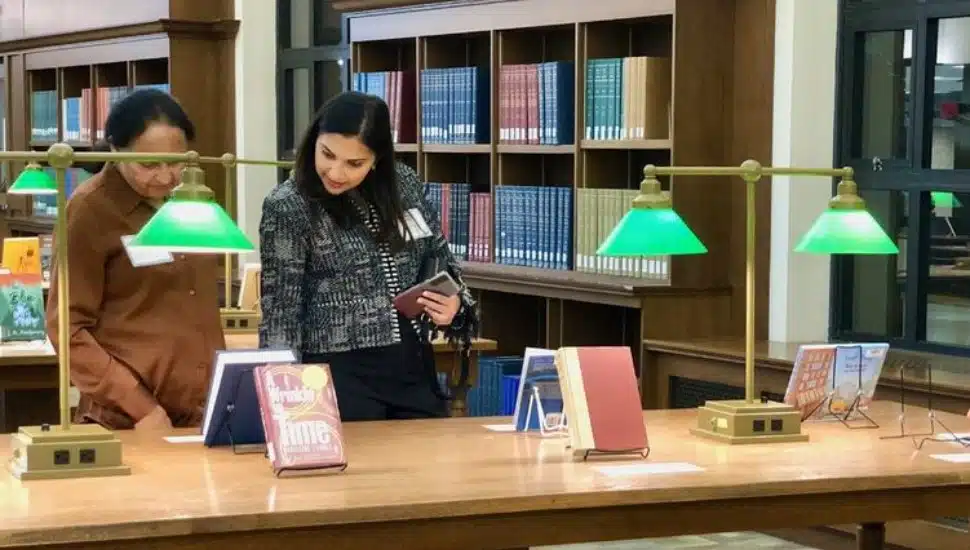 Penn State University faculty check out selected books on display at the Pattee Library at the University Park campus.