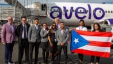 people in front of Avelo Airlines plane