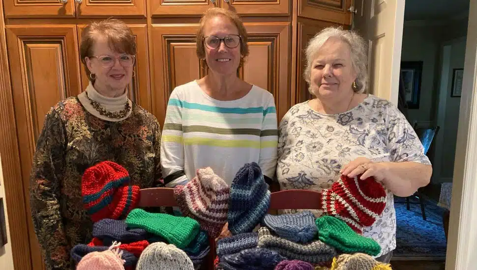 PIO volunteers with knitted hats