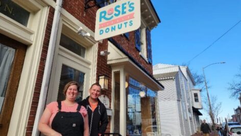 Beth and Justin Campbell in front of Rose's Little Donuts.