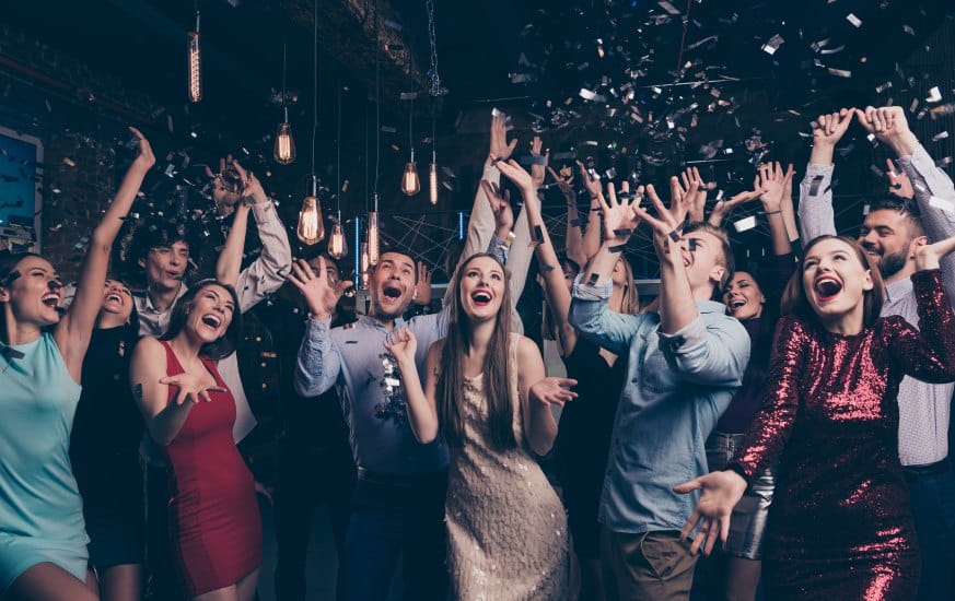 A group of people out on the dance floor.