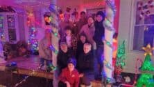 the Corrado family and others with christmas light