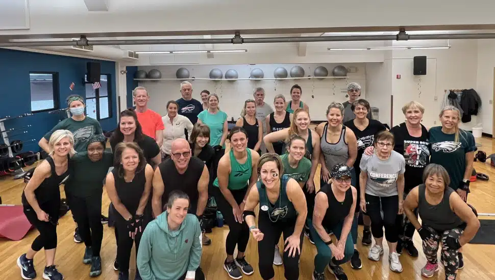 YMCA members pose for a photo after completing a themed Group Exercise Class.