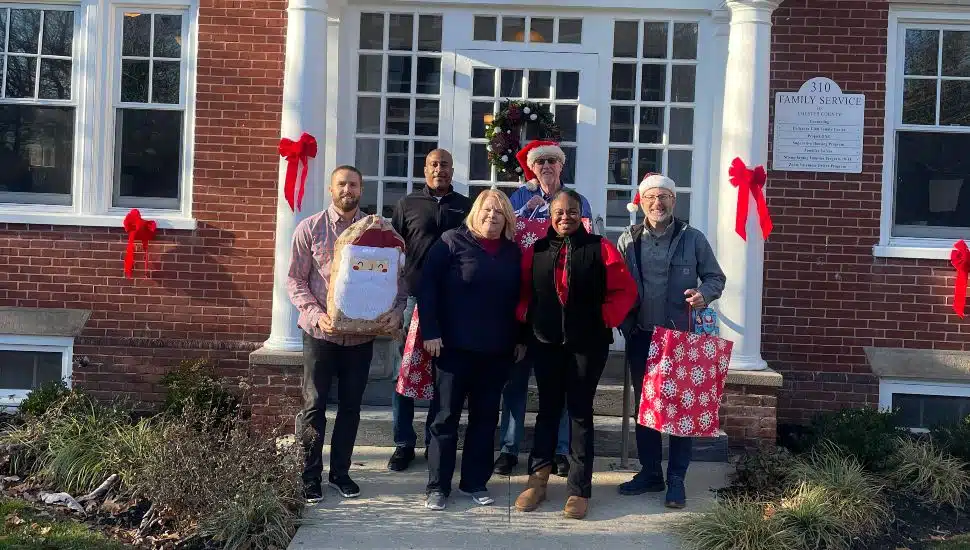 Staff and volunteers from Family Service of Chester County make gift deliveries after receiving .000 in community donations.