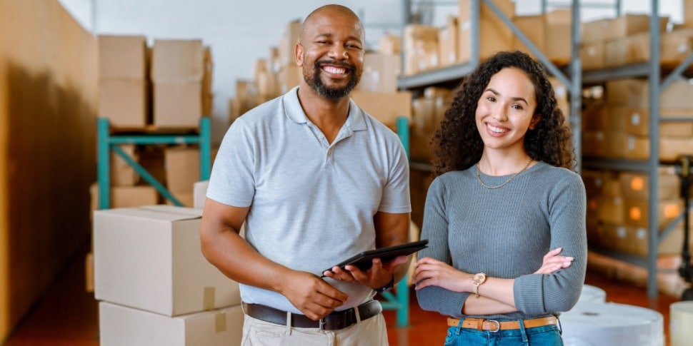 A Black man and woman in their small business