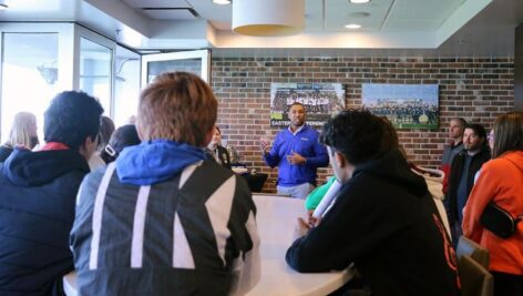 Tracy Jones, part of the adjunct faculty at Widener University's School of Business Administration, talks to high school students at Subaru Park.