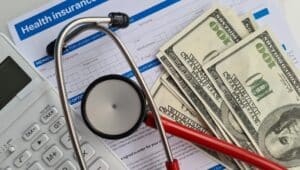 money, paper, doctor stethoscope. health insurance concept