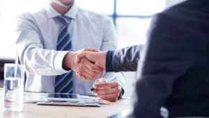 two men shaking hands, investment advisor, deal