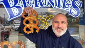 man holding pretzel