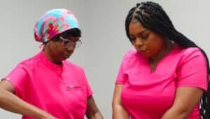 two women in pink scrubs