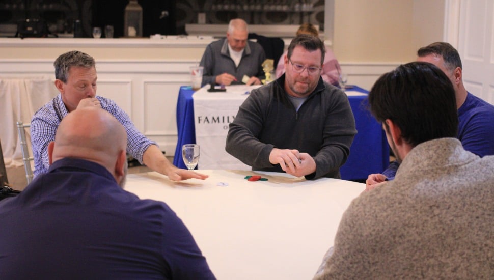 Players gather for a little poker at the Family Service of Chester County Chairty Poker Tournament.