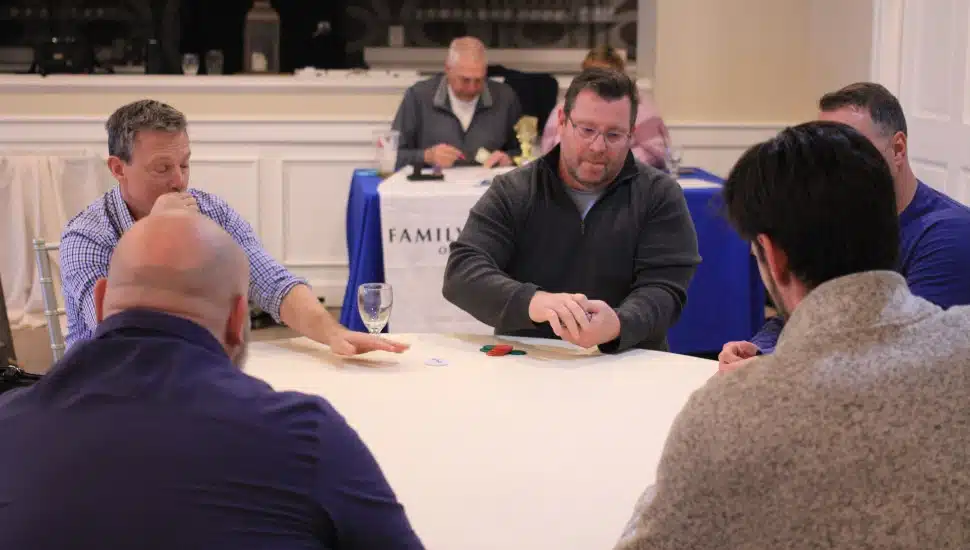 Players gather for a little poker at the Family Service of Chester County Chairty Poker Tournament.