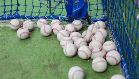 baseballs in batting cage