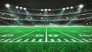 green field in american football stadium
