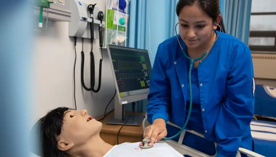 student practicing nursing skills.