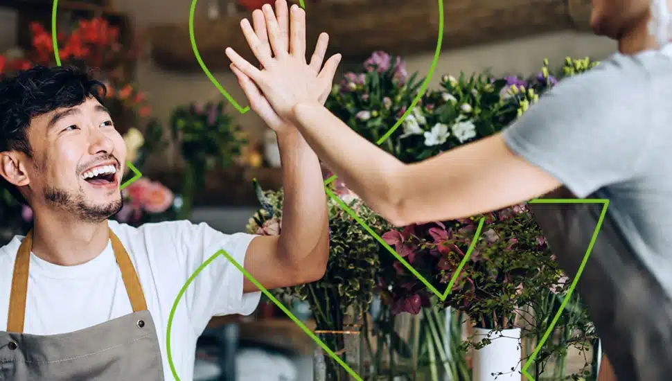 Man smiling with a high-five