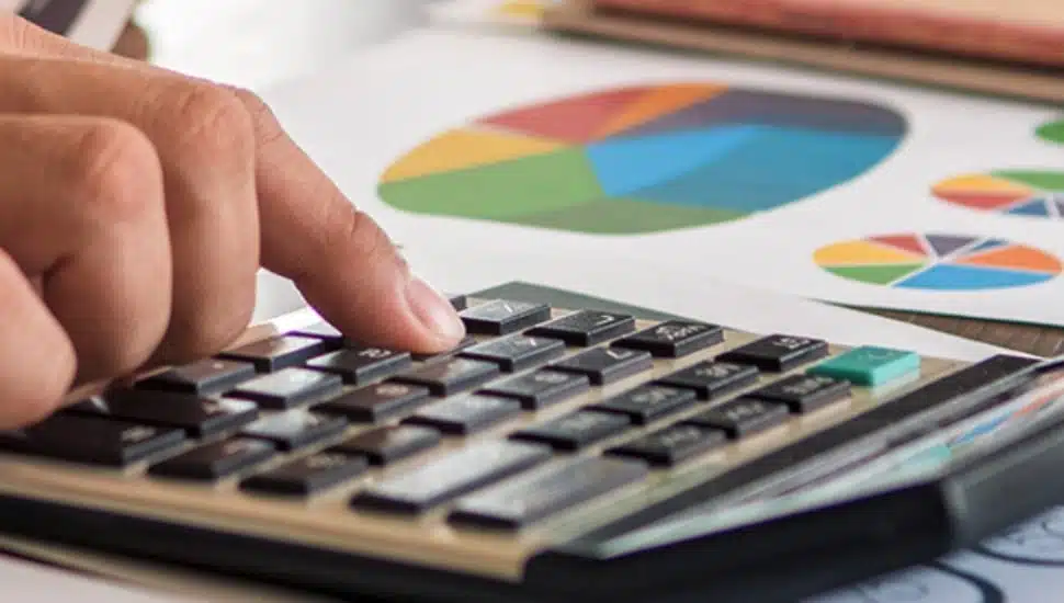 Image of charts and calculator.