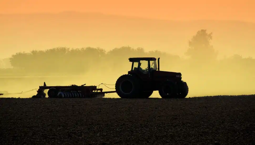 person on tractor in the fields