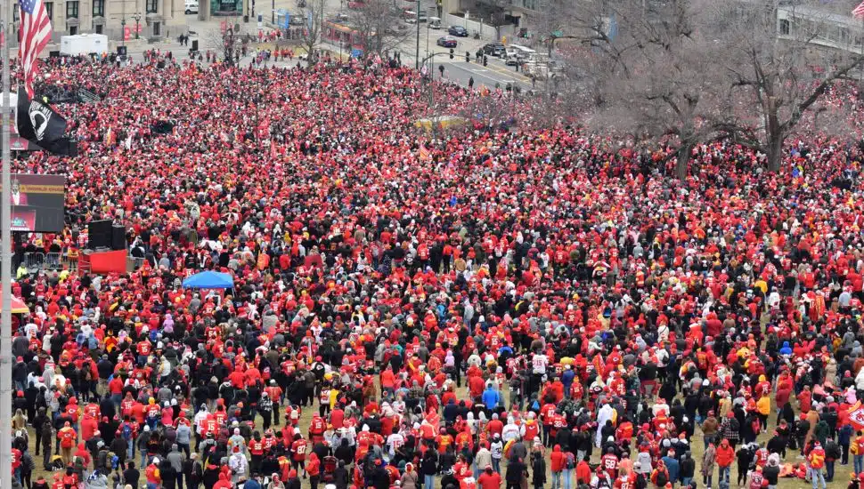 group of hundreds of fans wearing red