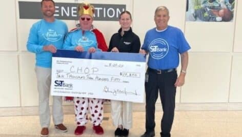 S&T Bank members holding a large check made out to CHOP.
