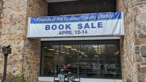 "Book Sale" banner in front of the library.