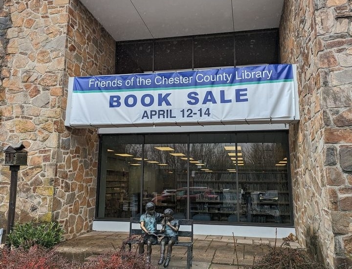"Book Sale" banner in front of the library.