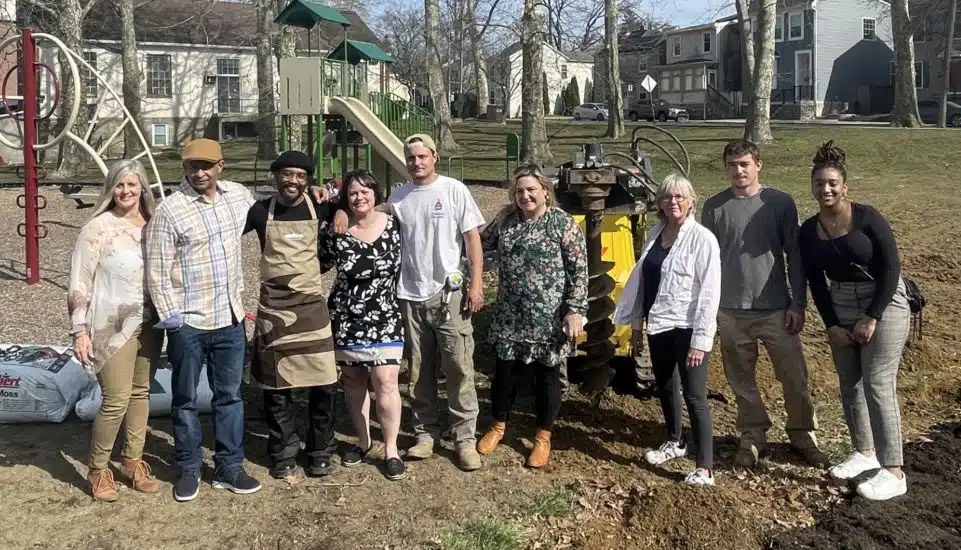 A Safe Harbor team gathers at a community garden site, which is being expanded and revitalized in West Chester.