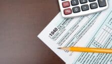 tax forms, pencil, and calculator