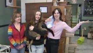 3 women at Treetops Kitty Cafe with cats