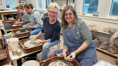 potters on the wheel at Centered Clay Studio