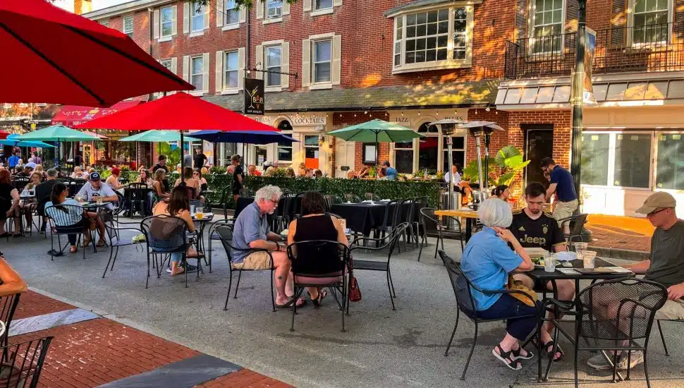 people dining outdoors at open air market